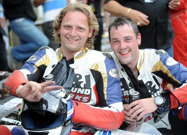 Klaus Klaffenbock and Dan Sayle celebrate victory at the 2010 Isle of Man TT fuelled by Monster Energy